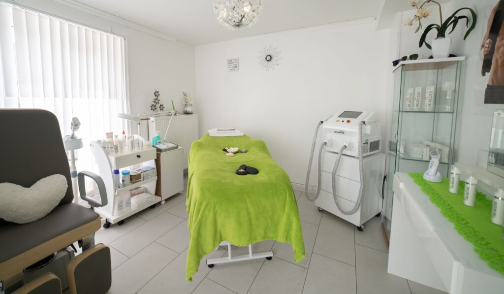 Professional massage table prepared in spa treatment room
